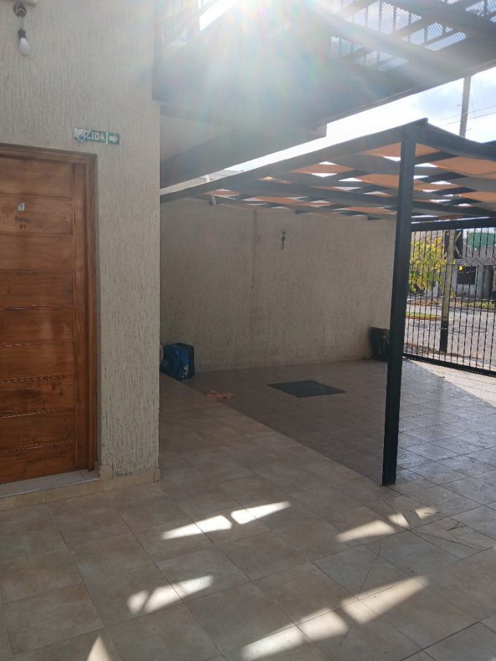 Alquilo departamento planta baja. Estar comedor cocina amoblada, 2 dormitorios con cochera techada.